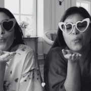 two girls with heart glasses on