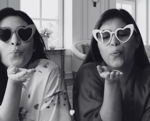 two girls with heart glasses on